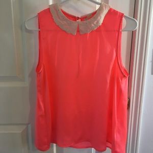 Bright pink sleeveless blouse w/ white lace collar